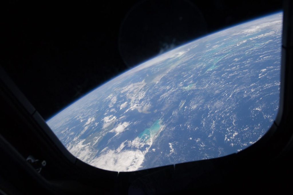 Distant view of plant earth from within a spacecraft