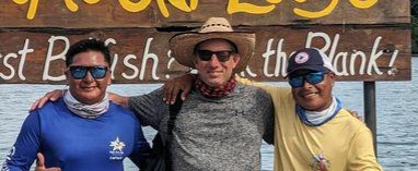 Dr. Dan Brooks poses with Captain Ermel and First-mate Rambo of the Embera people.